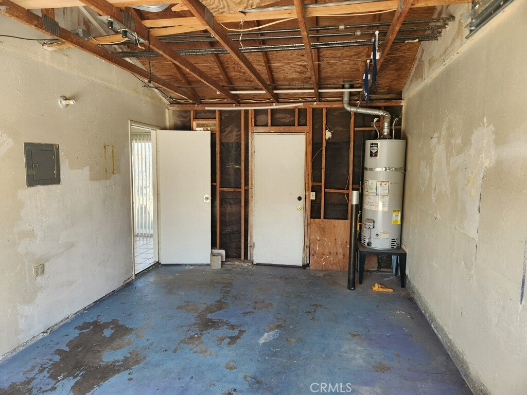 15418 Bear Valley Road, Unit 8 Victorville, CA 92395 - Photo 8 of 8 a view of a room with wooden walls