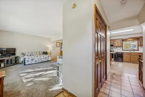 a view of a living room and kitchen