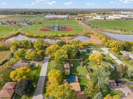 an aerial view of residential houses with outdoor space