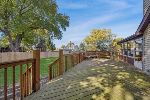 a view of a balcony with trees