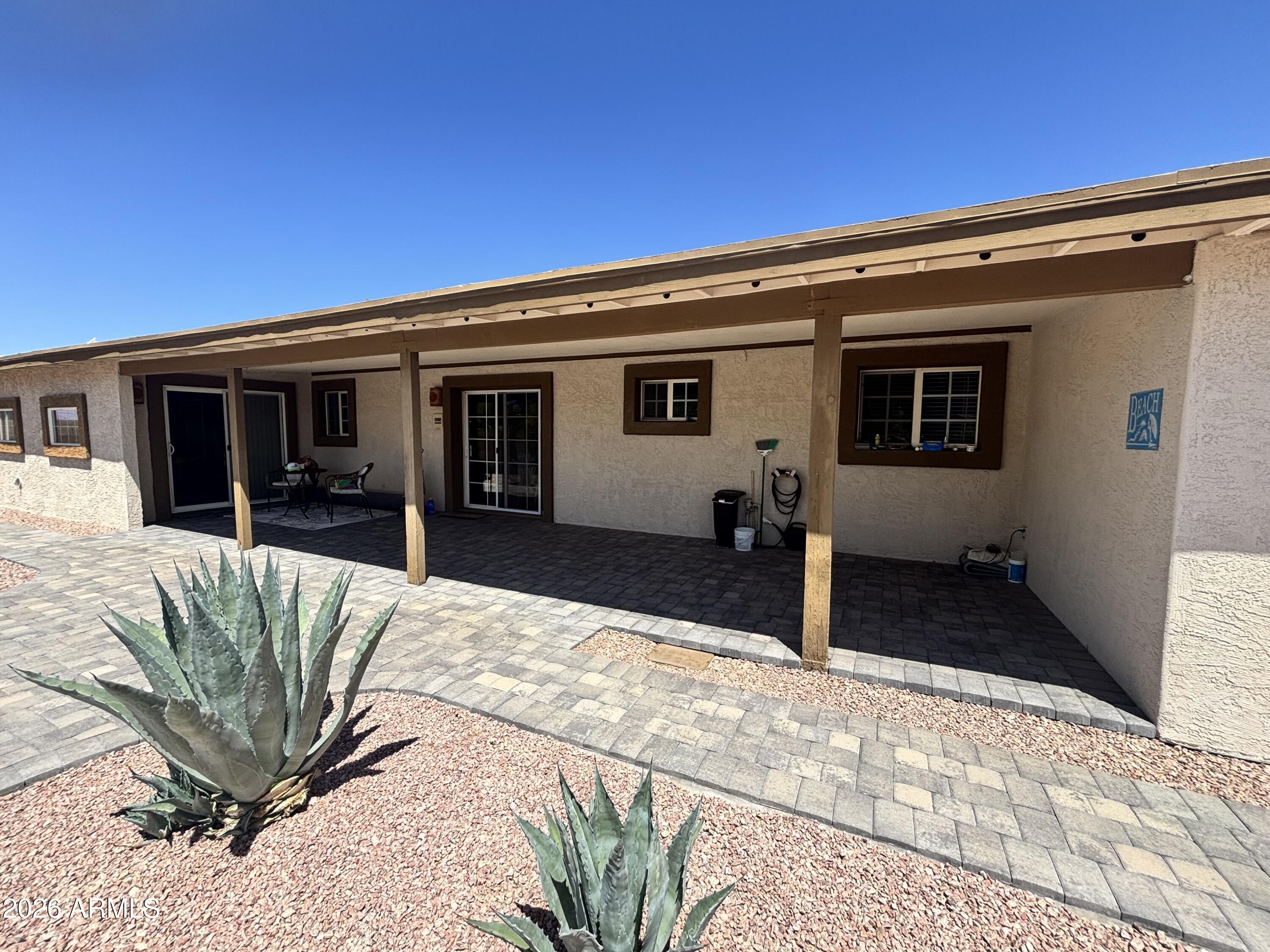 7745 East Mangun Road Mesa, AZ 85207 - Photo 14 of 35 a view of a house with a backyard