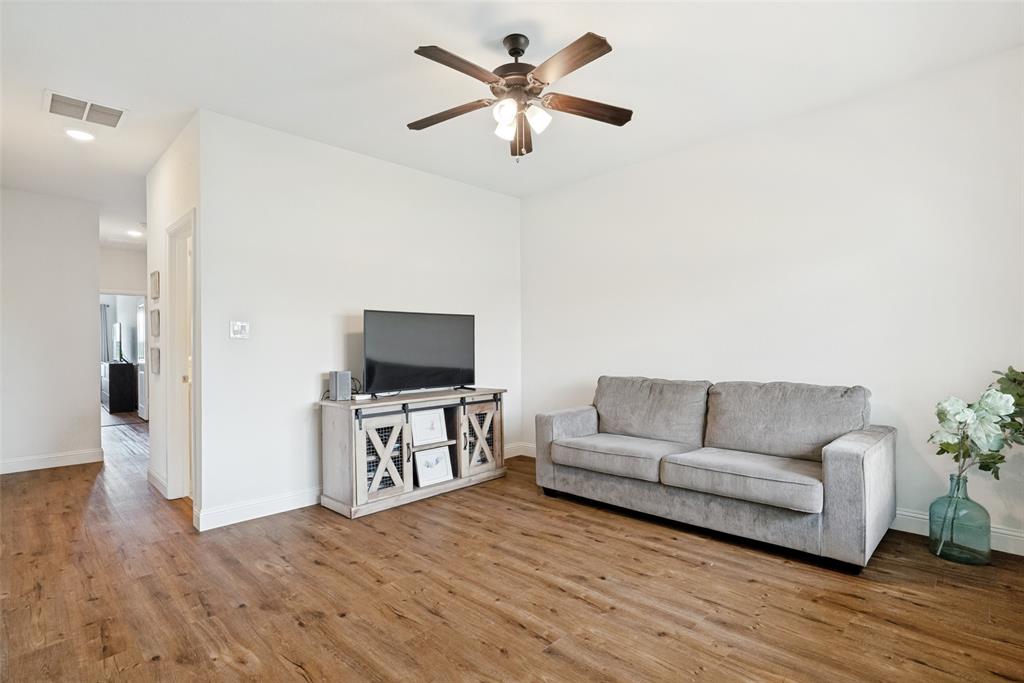 9424 Wildcat Ridge Godley, TX 76044 - Photo 15 of 25 a living room with furniture and a flat screen tv
