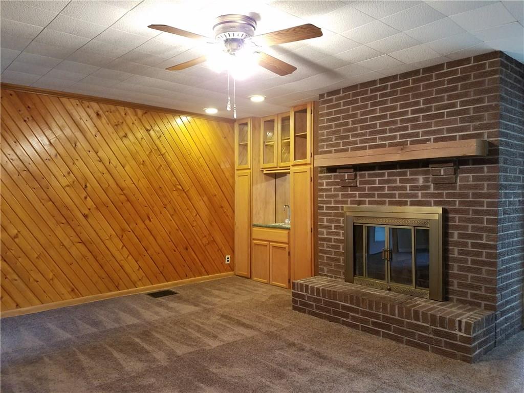 154 Stoup Road Mars, PA 16046 - Photo 12 of 25 Family Room with wet bar and brick fireplace with mantle! Brand new carpeting! Ceiling fan/light.