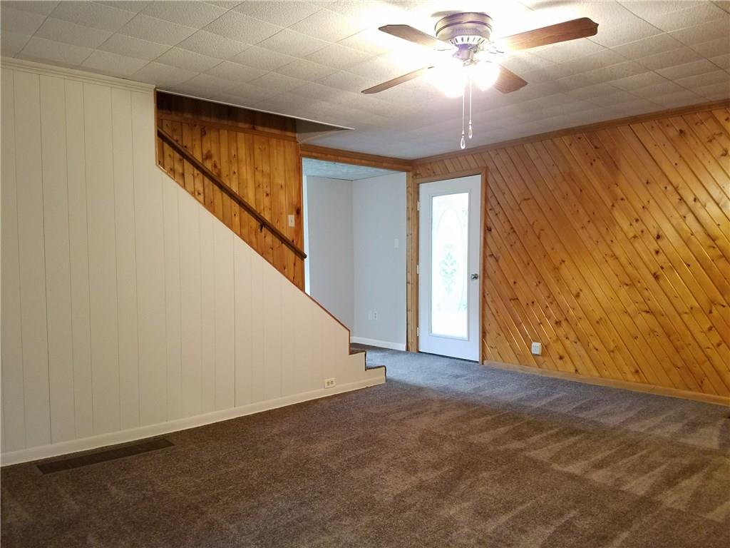 154 Stoup Road Mars, PA 16046 - Photo 13 of 25 Family Room with stairs to upper 2 BRs. Ceiling fan/light & brand new carpeting.