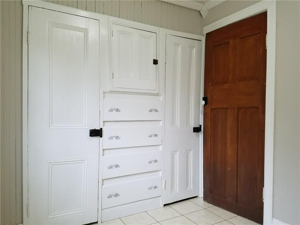 154 Stoup Road Mars, PA 16046 - Photo 14 of 25 First floor laundry with door to deck. Built-in drawers and closet provide extra storage