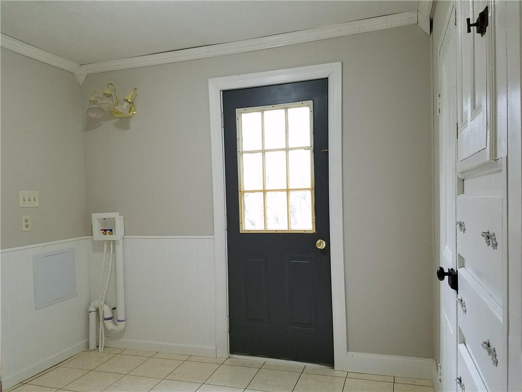 154 Stoup Road Mars, PA 16046 - Photo 15 of 25 First floor laundry with door to deck. Built-in drawers and closet provide extra storage.