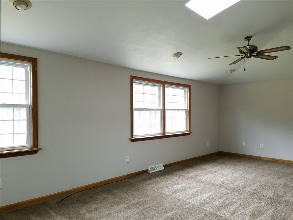 154 Stoup Road Mars, PA 16046 - Photo 17 of 25 Master Bedroom with brand new carpeting! 2 Walk-in closets, vaulted ceiling with skylight & ceiling fan/light, extra vanity area in BR outside of door to full bath.