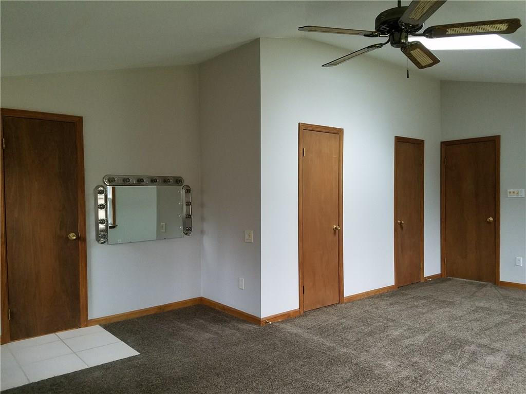 154 Stoup Road Mars, PA 16046 - Photo 18 of 25 Master Bedroom with brand new carpeting! 2 Walk-in closets, vaulted ceiling, extra vanity area in BR outside of door to full bath. Sky light and ceiling fan/light.