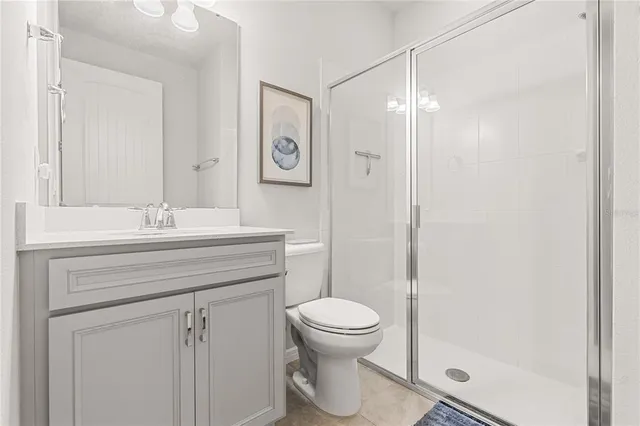 a bathroom with a toilet sink and shower