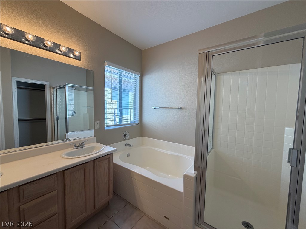 10975 Pumpkin Ridge Avenue Las Vegas, NV 89135 - Photo 6 of 13 A pristine bathroom features a convenient shower and a deep soaking tub for relaxation.