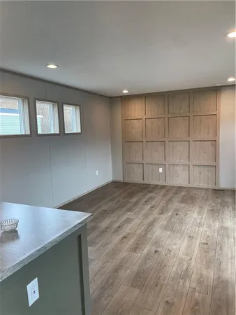 a kitchen with stainless steel appliances granite countertop a sink stove and a window