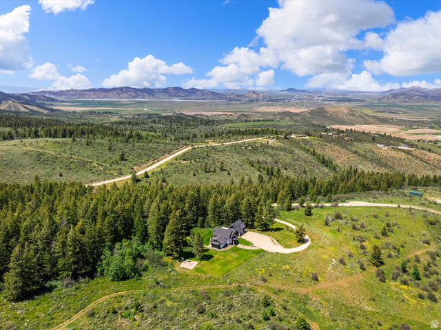 1225 Old Oregon Road Soda Springs, ID 83276 - Photo 65 of 67 Elevated property featuring a large residence, expansive green lawn, and a winding driveway