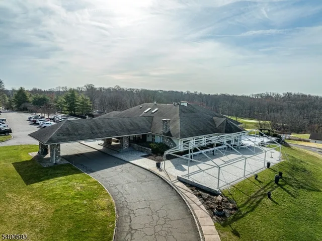 an aerial view of a garden with swimming pool