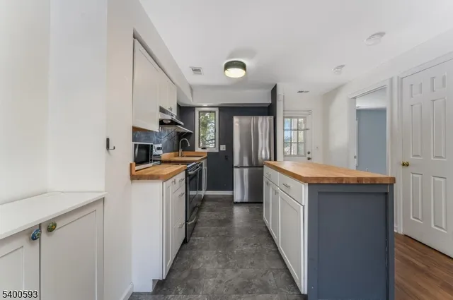 a kitchen with a sink and counter top