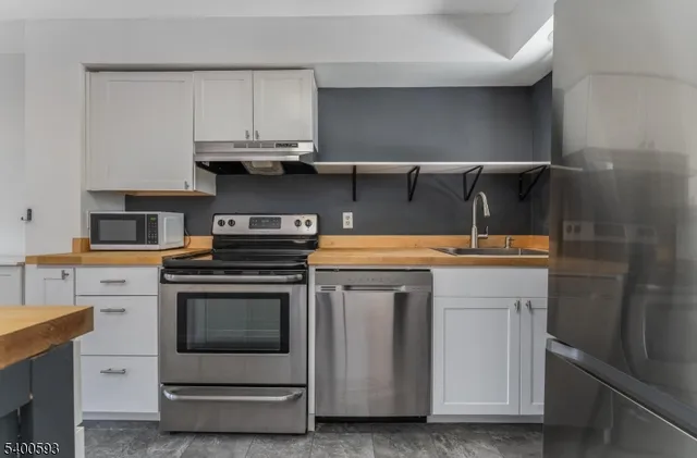 a kitchen with a stove and a sink