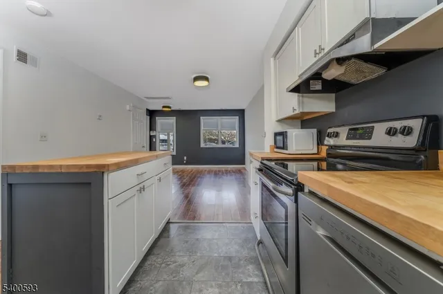 a kitchen that has a sink and a stove