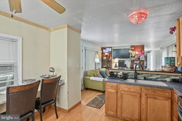 a dining room with furniture and a chandelier