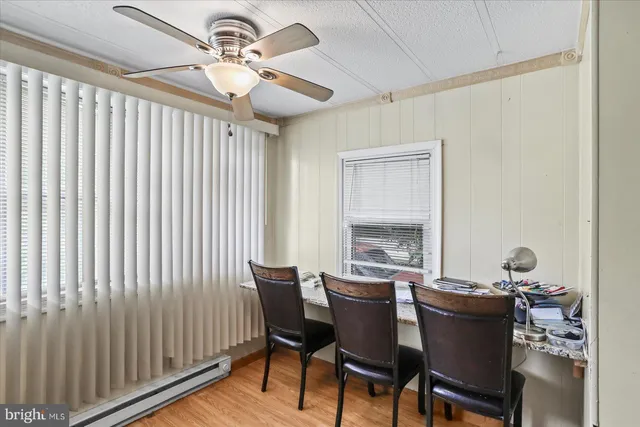 a dining room with furniture and window