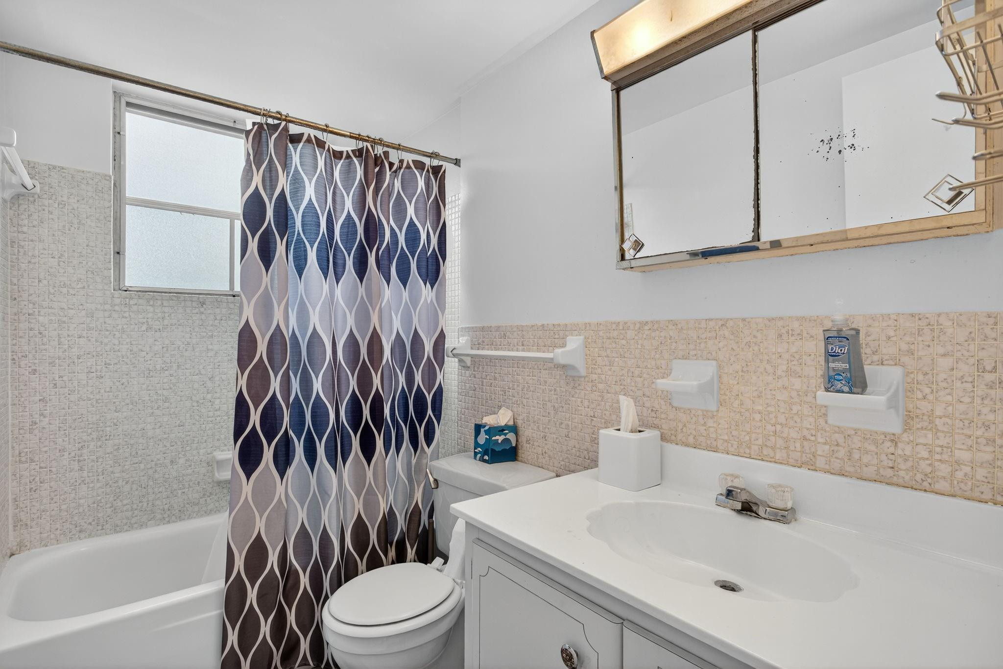 418 South Cypress Road, Unit 110 Pompano Beach, FL 33060 - Photo 13 of 28 a bathroom with a sink toilet and shower