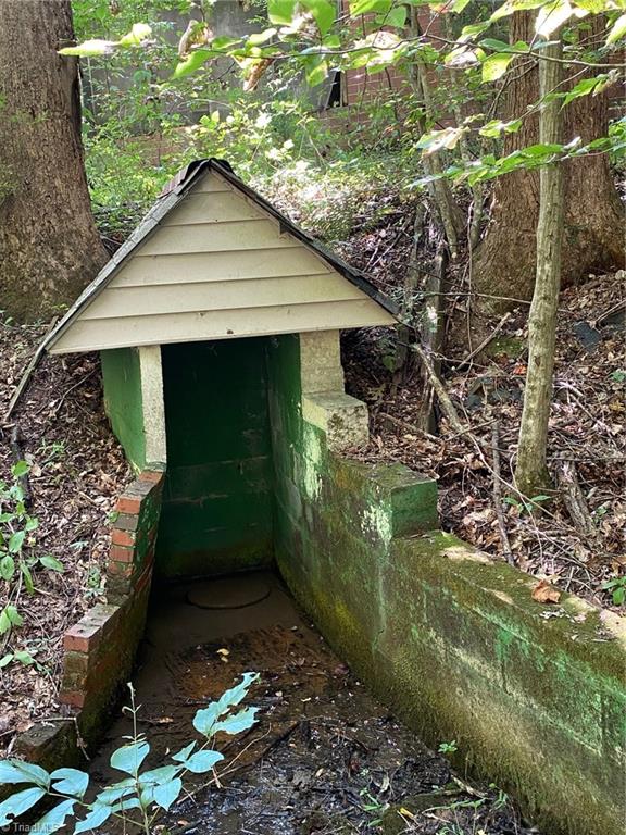 18.96 Bear Road Madison, NC 27025 - Photo 8 of 16 old cover to a spring for fresh drinking water.