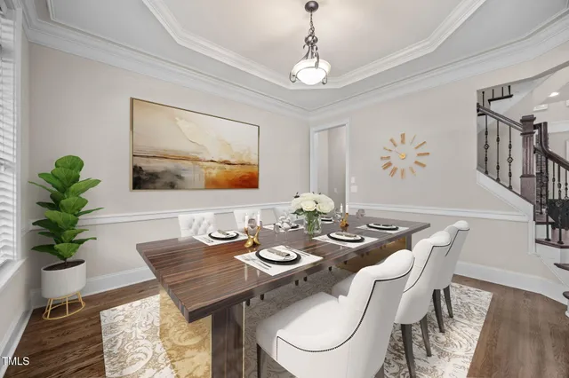 a kitchen with kitchen island granite countertop wooden floors and refrigerator