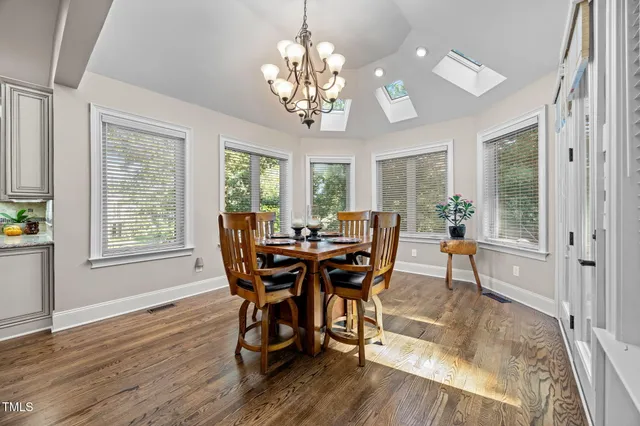 a bathroom with a shower sink and mirror