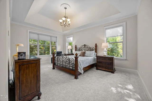 a bedroom with a bed and dresser