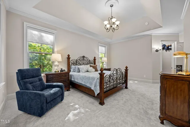 a bedroom with a bed window and a night stand