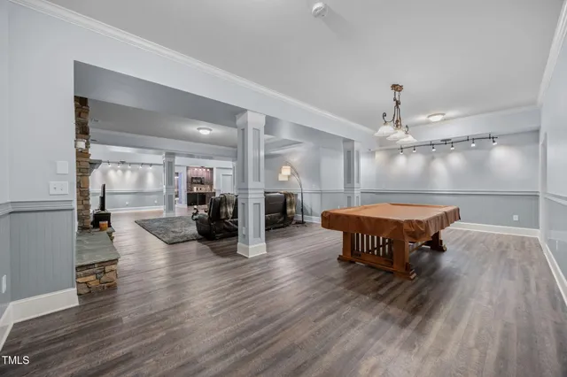 a bathroom with a double vanity sink a toilet and a mirror