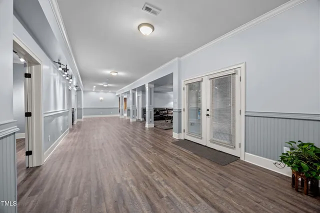 a view of a house with swimming pool and sitting area