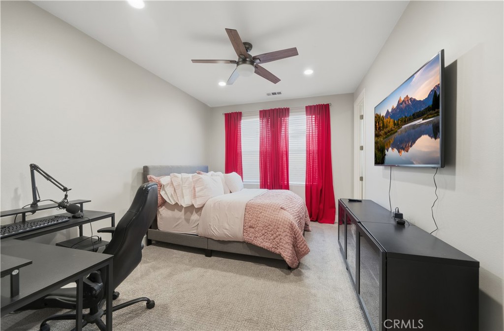 346 Ventasso Way Fallbrook, CA 92028 - Photo 19 of 56 a bed room with a bed tv and a window