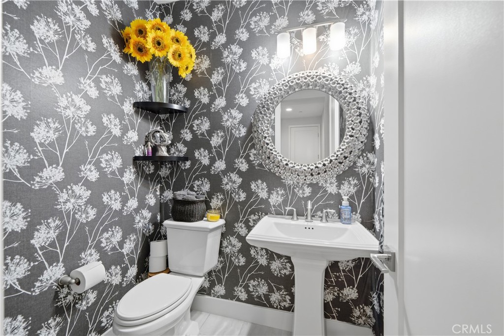 346 Ventasso Way Fallbrook, CA 92028 - Photo 21 of 56 a bathroom with a sink a toilet and a mirror