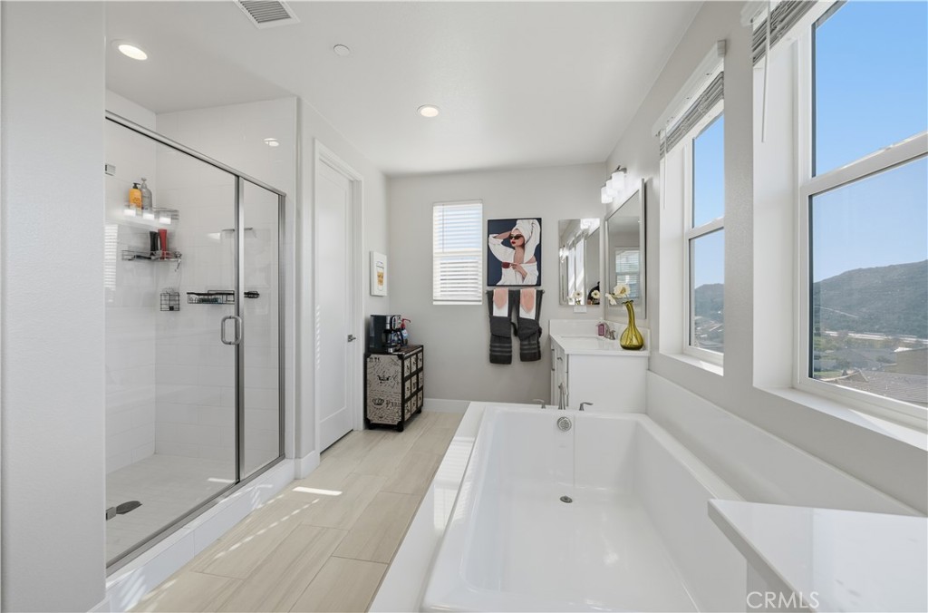 346 Ventasso Way Fallbrook, CA 92028 - Photo 33 of 56 a spacious bathroom with a tub shower and windows