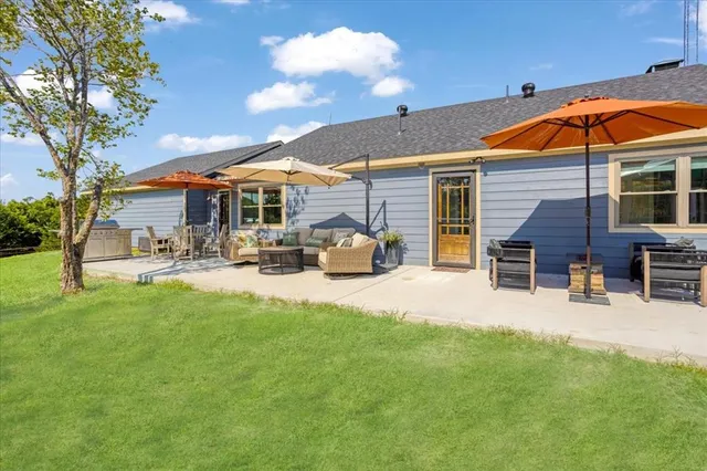 a front view of house with yard and seating area