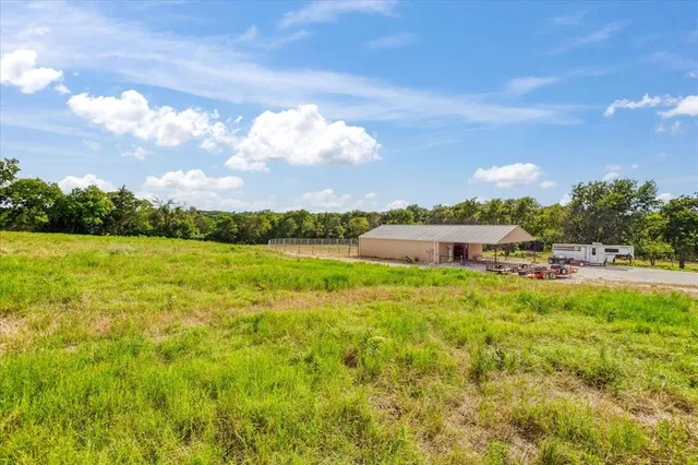 a view of a lake with houses in the back