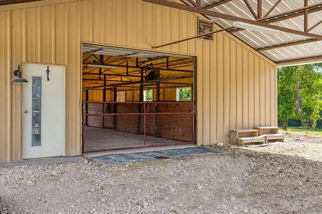 a view of a backyard with wooden fence
