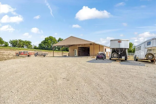 a view of a car park in front of house