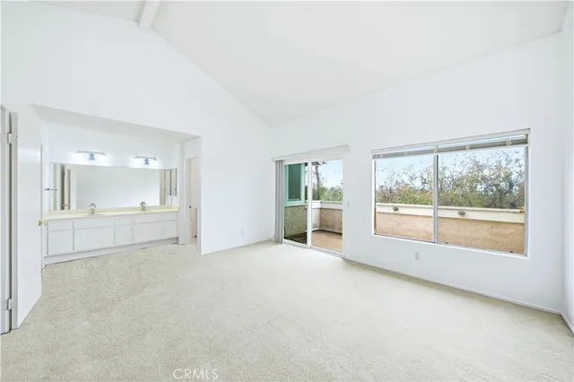 a aerial view of a house with a lake view