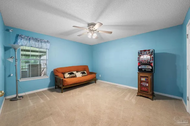 a bedroom with furniture and window