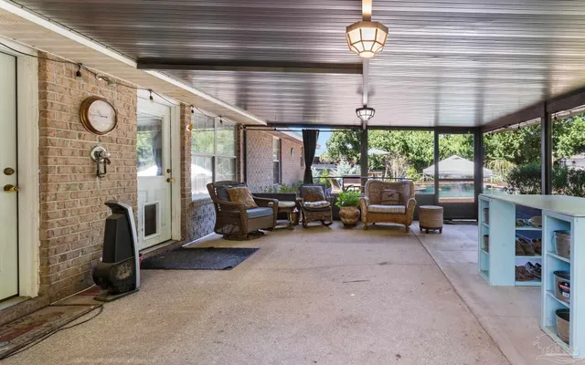 a living room with patio area and a table