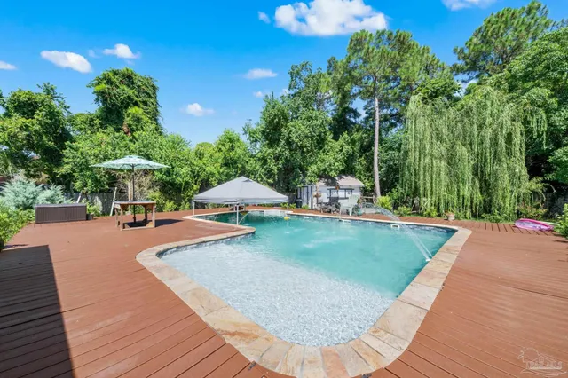 a view of a swimming pool with a patio