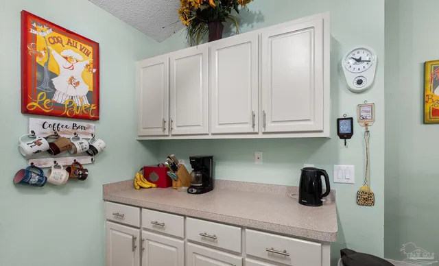a kitchen with a cabinets and a window