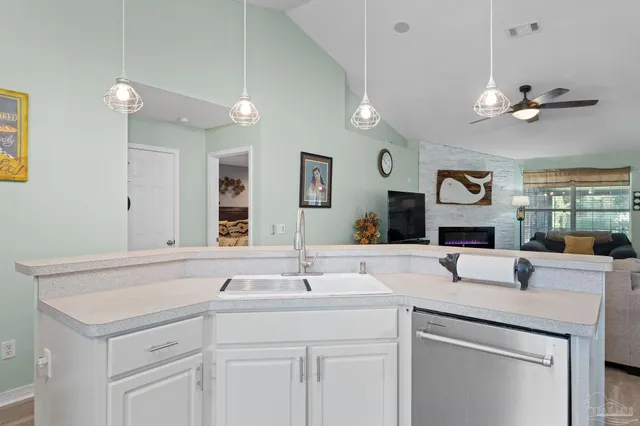 a spacious bathroom with a sink and a mirror