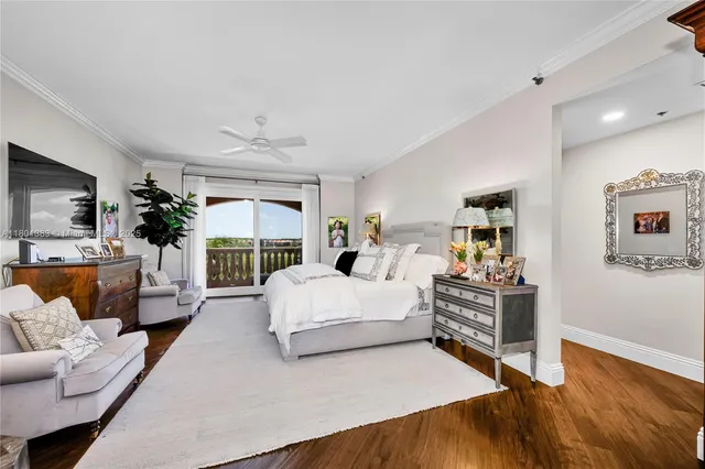 a spacious bedroom with a bed and a couch