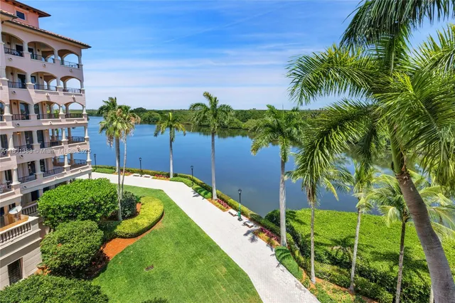 an aerial view of a house with a lake view