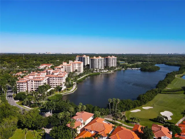an aerial view of a house with a lake view