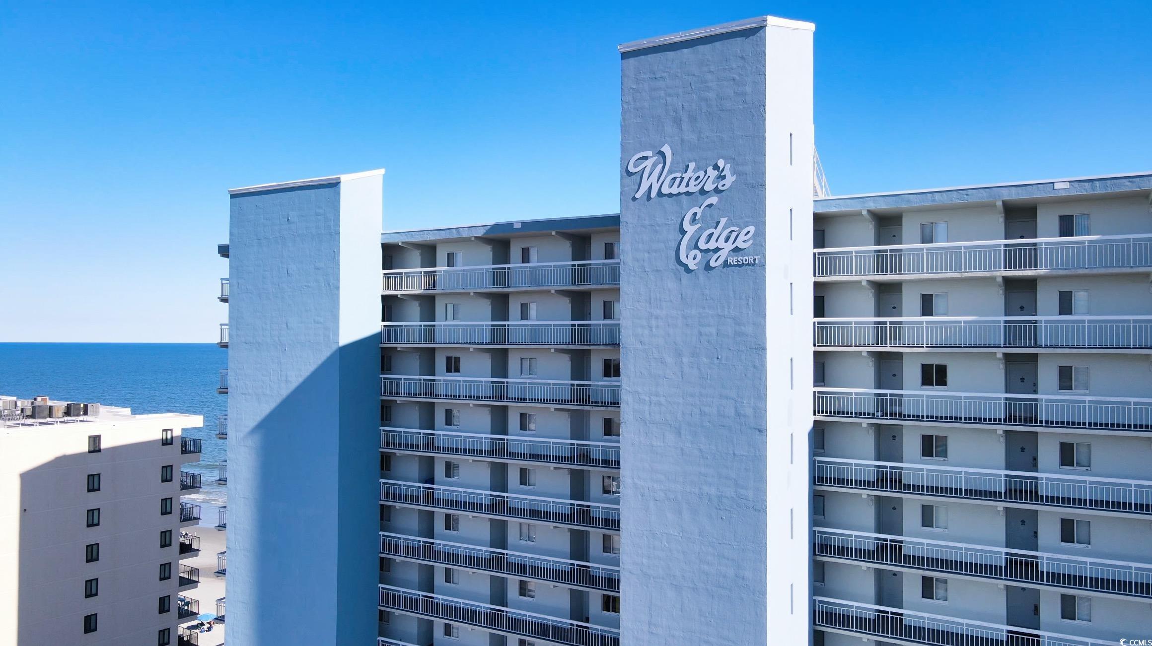 1012 North Waccamaw Drive, Unit 305 Murrells Inlet, SC 29576 - Photo 1 of 38 View of apartment building / complex with a water view