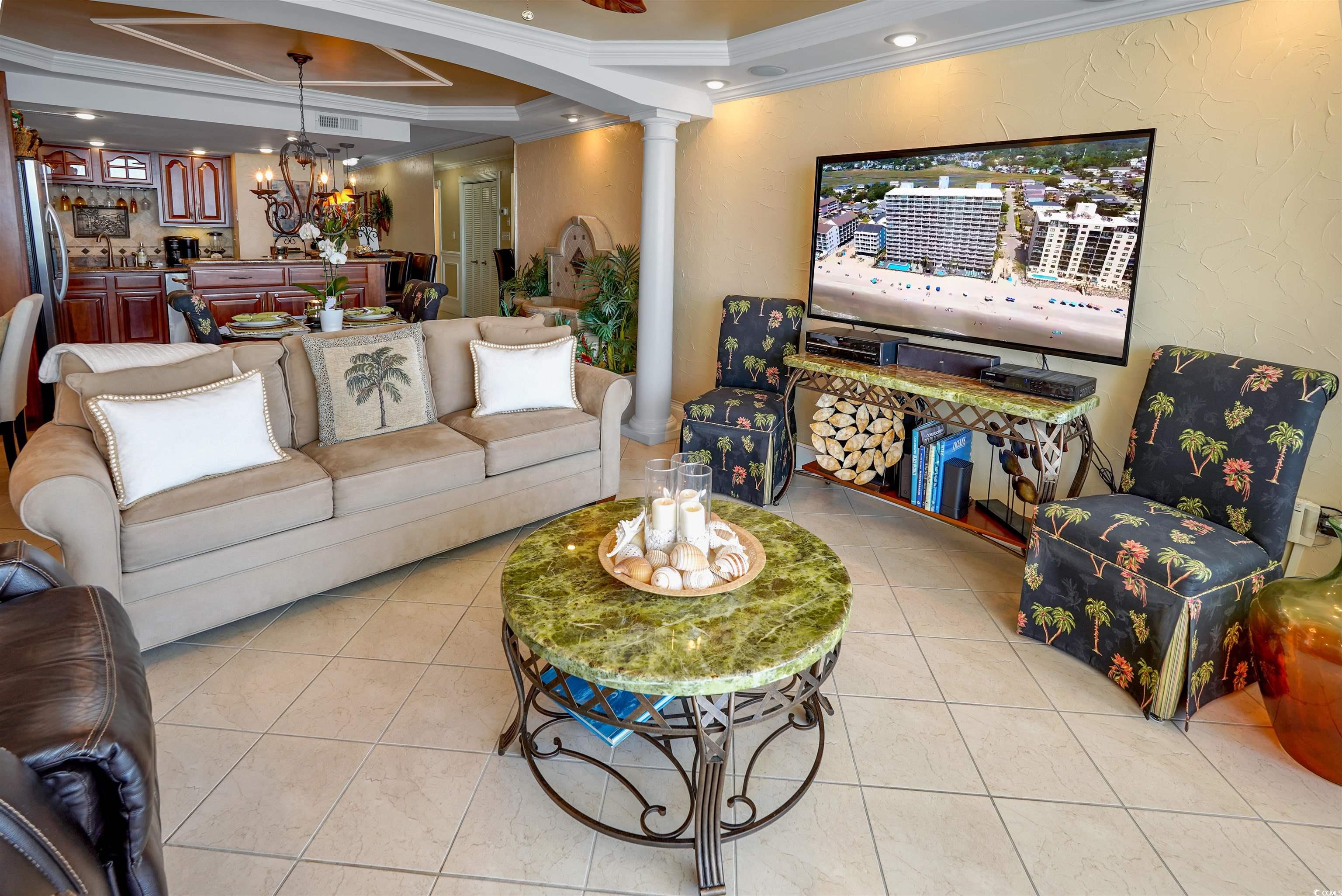 1012 North Waccamaw Drive, Unit 305 Murrells Inlet, SC 29576 - Photo 11 of 38 Living area with ornamental molding, ornate columns, light tile patterned floors, a chandelier, and recessed lighting