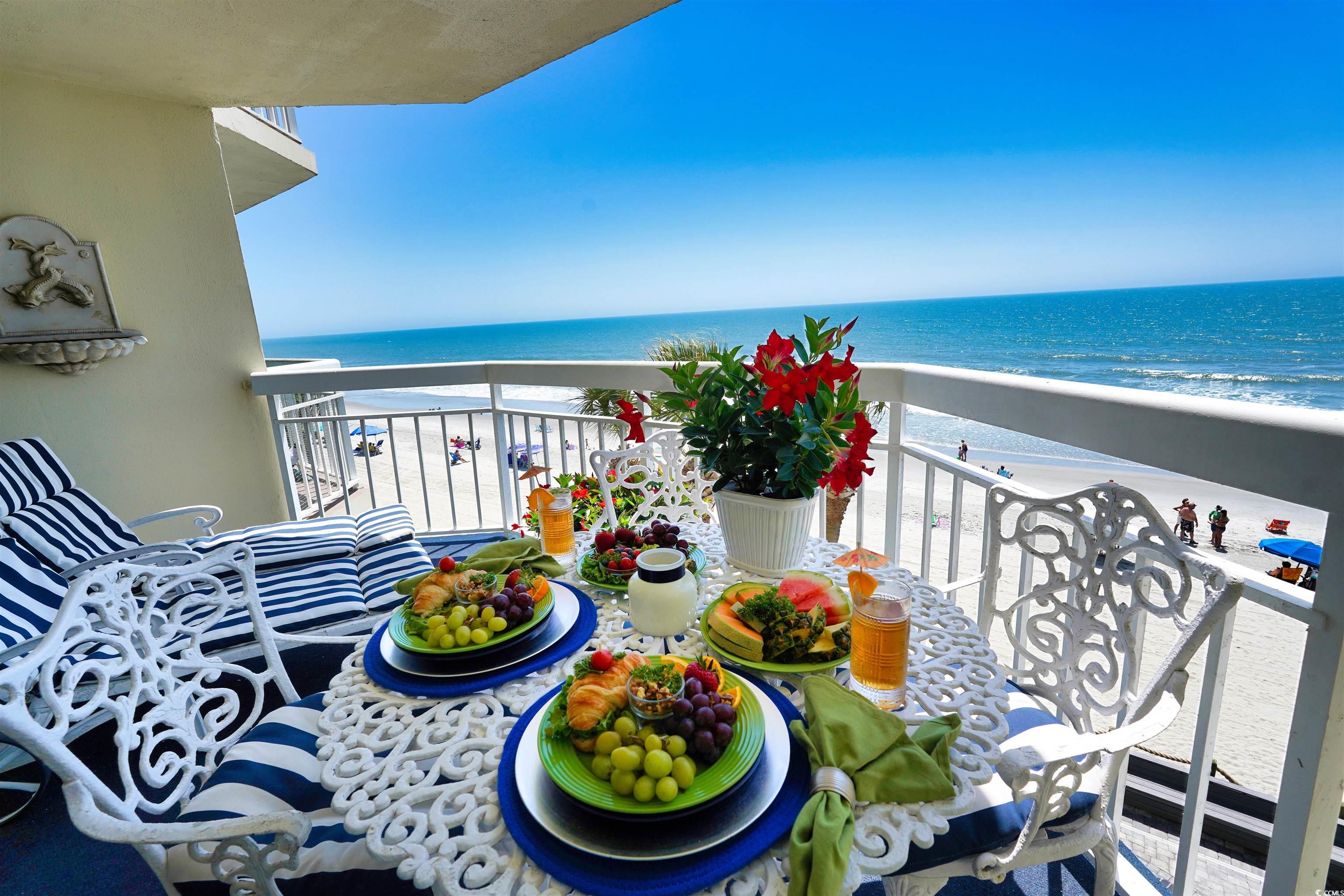 1012 North Waccamaw Drive, Unit 305 Murrells Inlet, SC 29576 - Photo 30 of 38 Balcony featuring view of water and beach