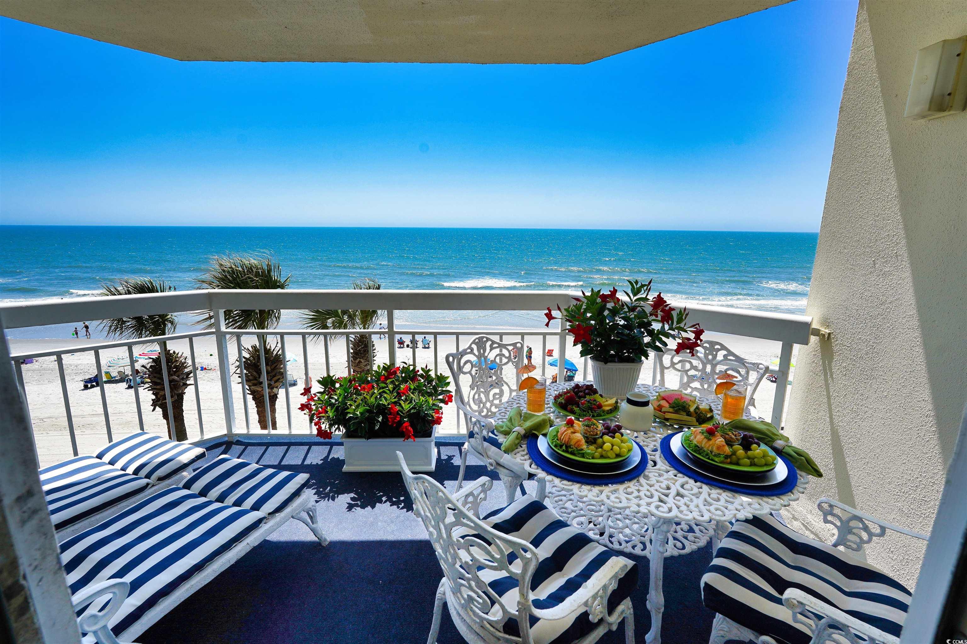 1012 North Waccamaw Drive, Unit 305 Murrells Inlet, SC 29576 - Photo 3 of 38 Balcony with view of water and beach